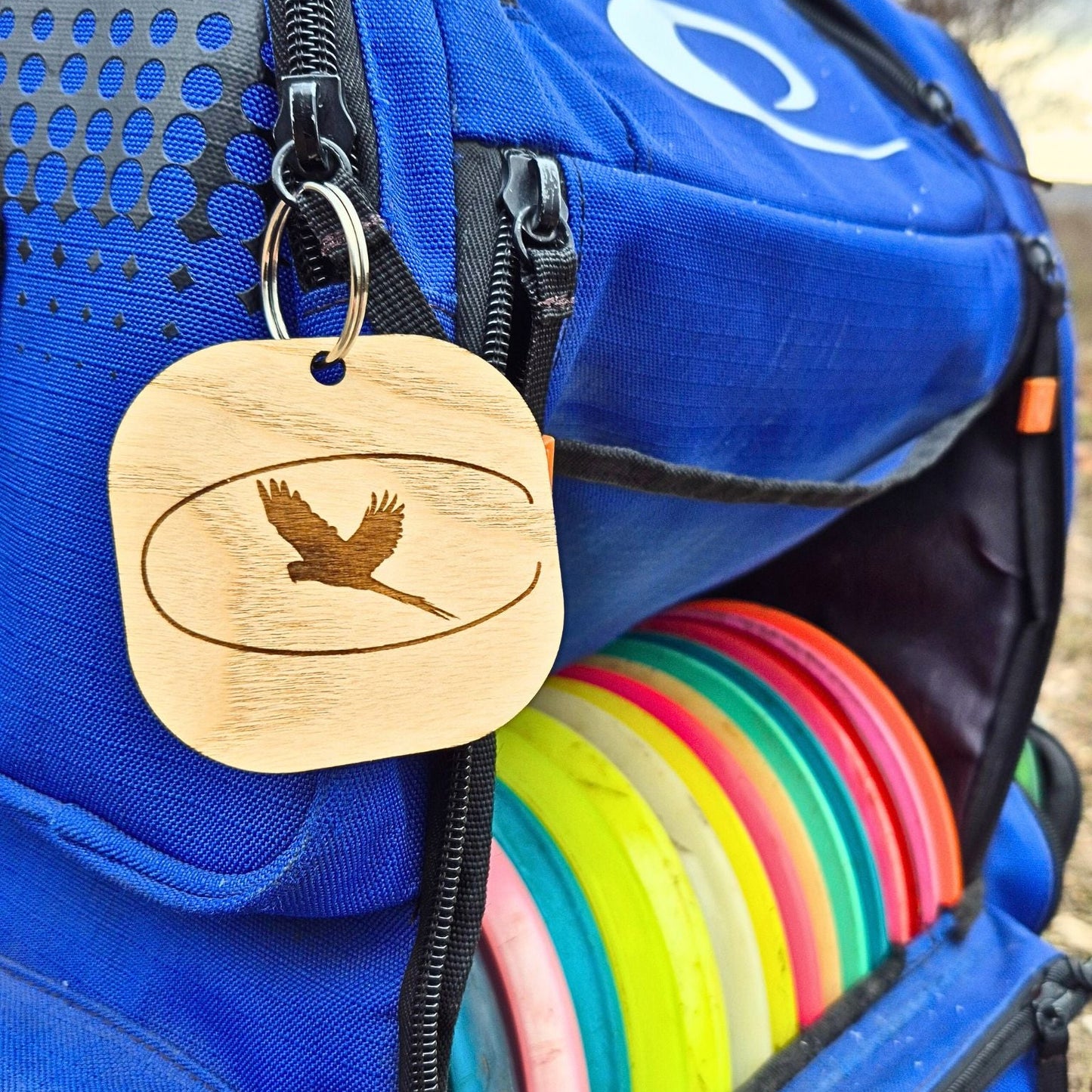 Customized wooden logo tag on disc golf bag ash