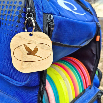 Customized wooden logo tag on disc golf bag ash