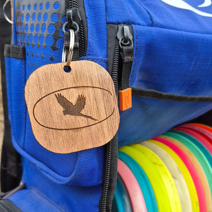 Customized wooden logo tag on disc golf bag walnut